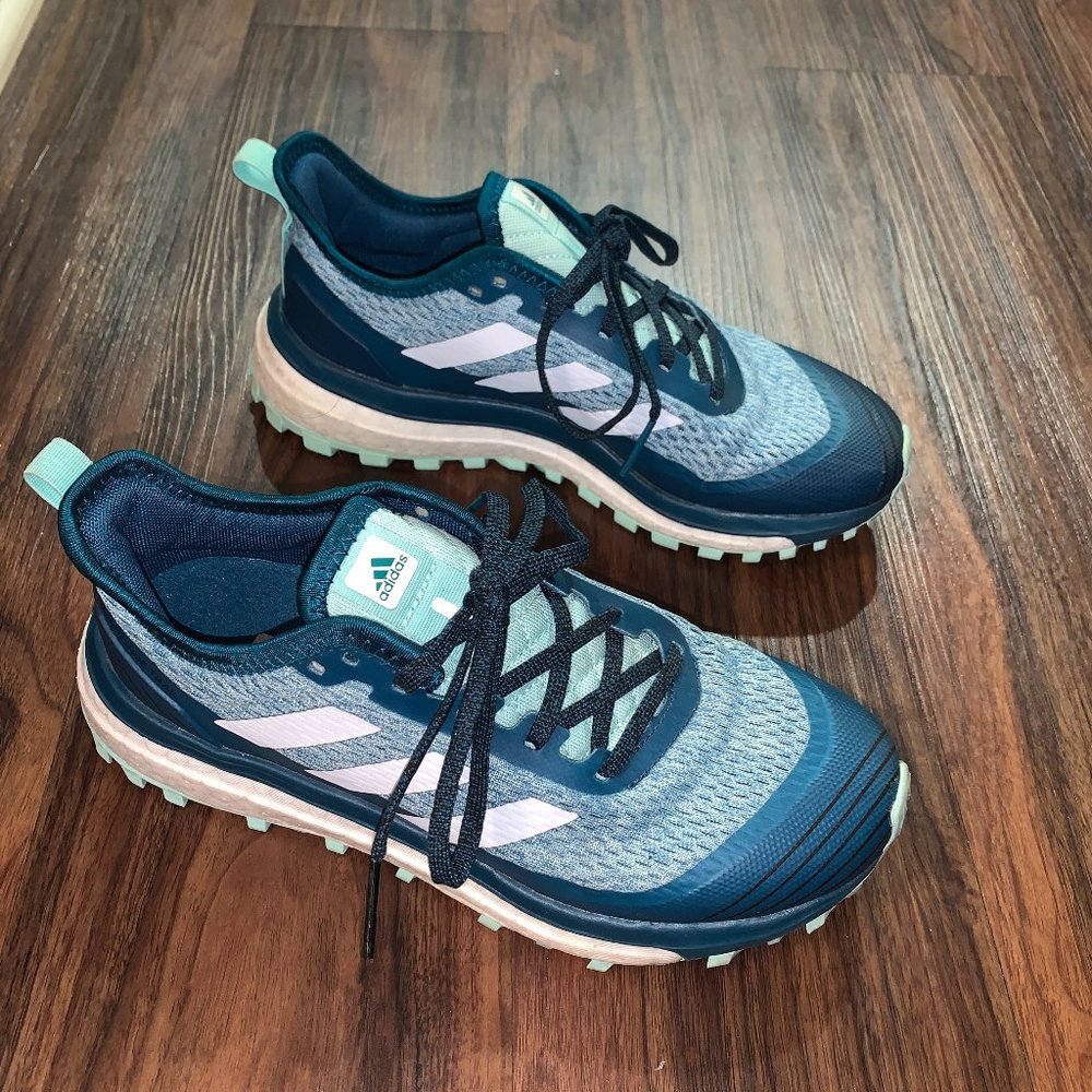 Blue adidas running shoes